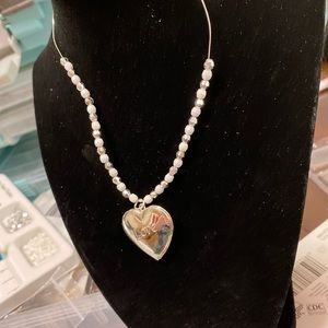 Hand made silver locket with silver and white beads
